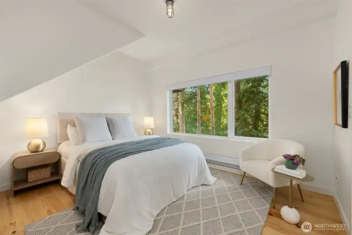 The bedroom is on the 2nd floor, and also enjoys the privacy and views provided by the trees.