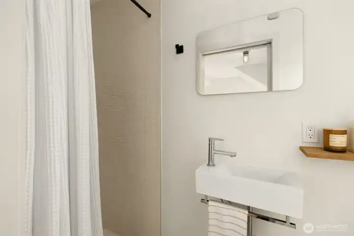 Off the bedroom, you’ll find a 3/4 bath with a large shower and heated tile floors.