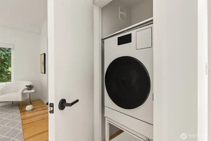 A combo washer/dryer allows for storage above and below, but a stacking set also fits here if preferred.