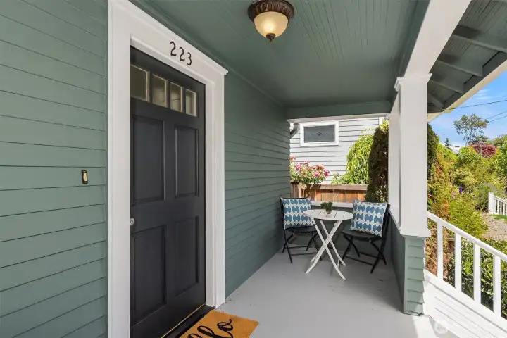 The covered porch is the perfect place to greet guests and enjoy a shaded retreat from the day.