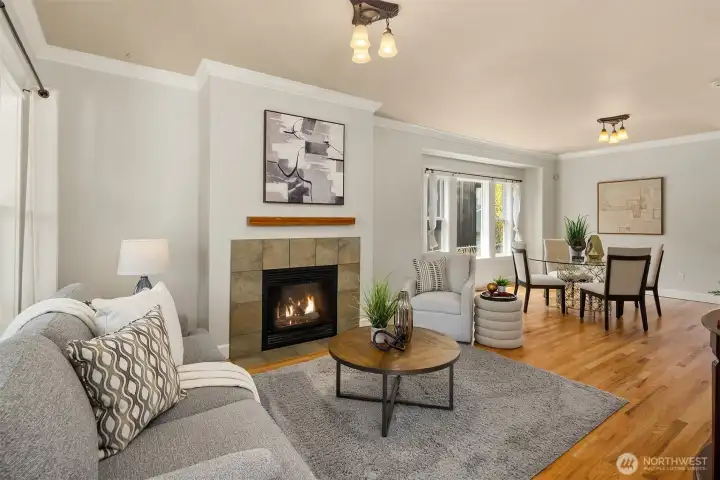 Soaring ceilings, gas fireplace, newly refinished hardwood floors, and beautiful millwork - this living room delivers.