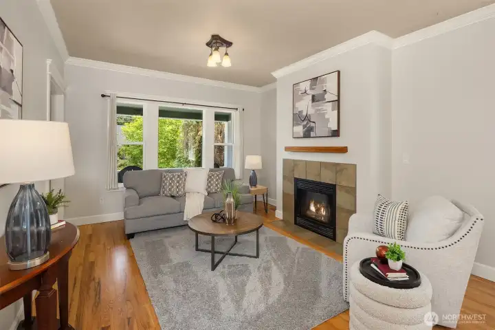 Generous proportions, beautiful natural light, and hardwood floors throughout - this living room earns its keep.