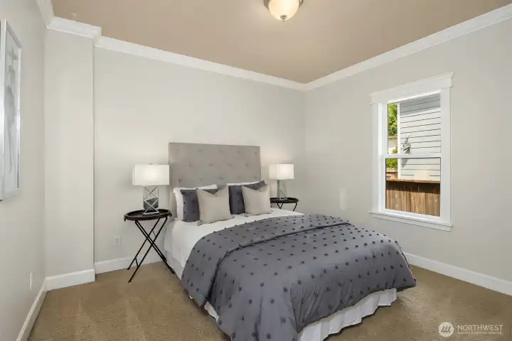 The larger of the two main-level bedrooms - serene and spacious with great natural light.
