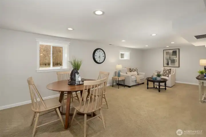 The lower level family room surprises with its generous footprint, fresh paint, and comfortable ceiling height.