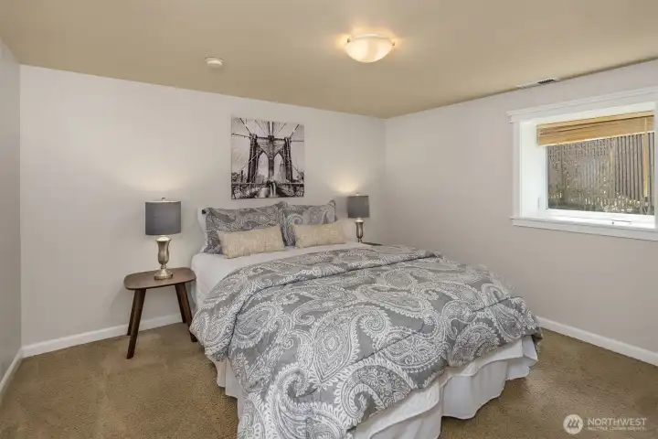 The lower level bedroom - well-sized with natural light.