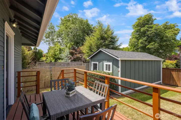 Another look at the deck and how it connects with the fully fenced backyard and garage.