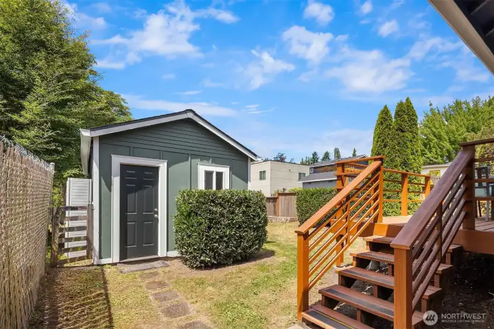 The freshly-painted garage has easy access to the backyard and home.