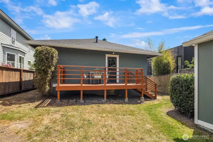 The back deck and yard - fully fenced, private, and the perfect spot to unwind or entertain.