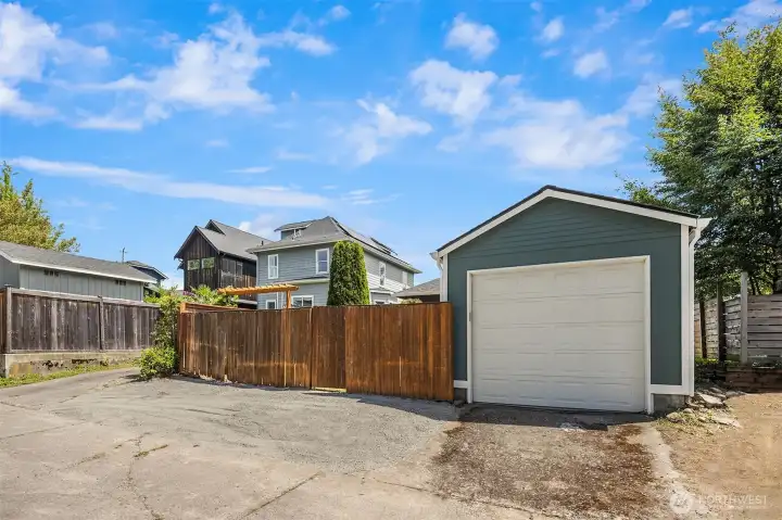 Alley-load detached garage plus a dedicated parking pad - and easy street parking out front. Parking is never a problem here.