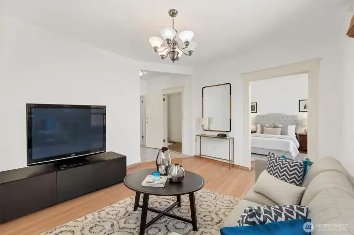 Virtually staged living room and bedroom of unit 3