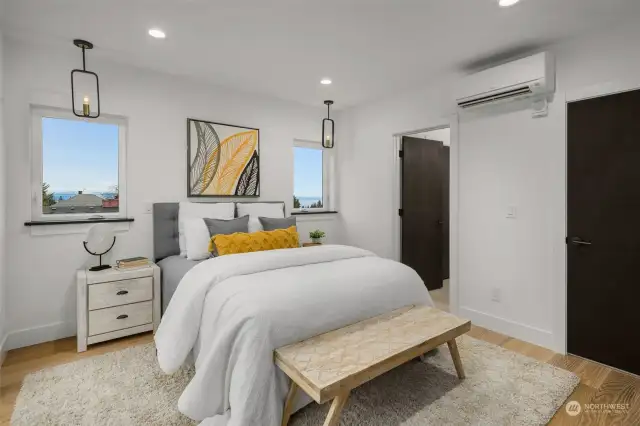 Primary bedroom features a private balcony, walk-in closet and en-suite connection to a private bathroom