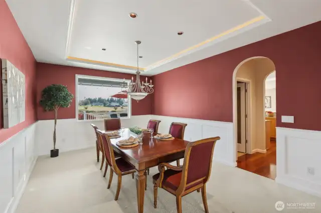 Welcome to your new dinner party haven! With stunning arched doorways and an LED-lit tray ceiling, this formal dining room is dripping with elegance. The classic white wainscoting adds a timeless touch, making every meal feel like a special occasion. Whether it’s a casual family dinner or an extravagant soirée, this space has you covered. Let the entertaining begin!
