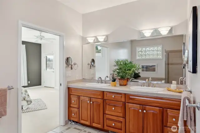 Mirror, mirror on the wall—who’s the most fabulous of them all? This primary suite vanity steals the spotlight with its extra-wide mirror and stunning brushed nickel fixtures. Dual vanities mean you can get ready side by side without a hitch. With sleek granite countertops providing a perfect blend of style and function, this space isn’t just for getting ready; it’s where you’ll start every day feeling like a star.