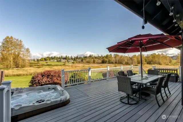 On this deck, every moment is picturesque! Cloud-covered Mt. Rainier looms in the distance as you relax in the built-in hot tub, with easy access right from your spot. Overlooking the wetlands, it’s the perfect blend of comfort and stunning views. Who wouldn’t want to call this home?