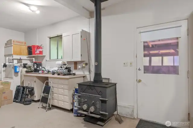 Back door toward garden shed and wood storage, woodstove keeps it comfy for winter projects