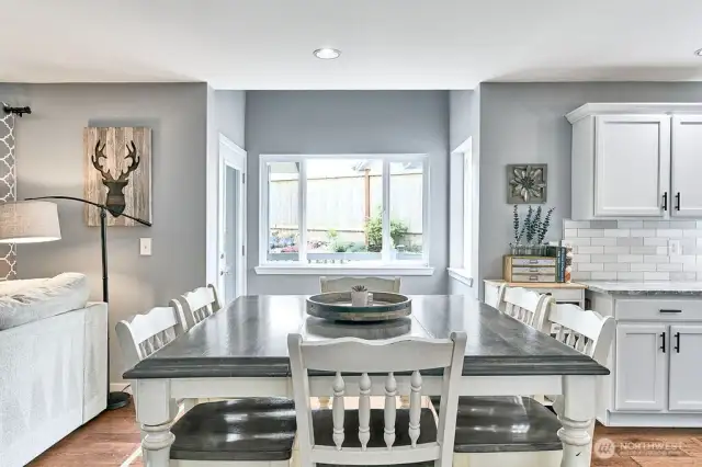 Dining area looking to nook with door to back entertaining and BBQ patio