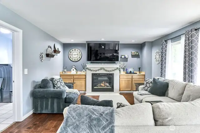 Living area with gas fireplace and built-ins for decor and storage