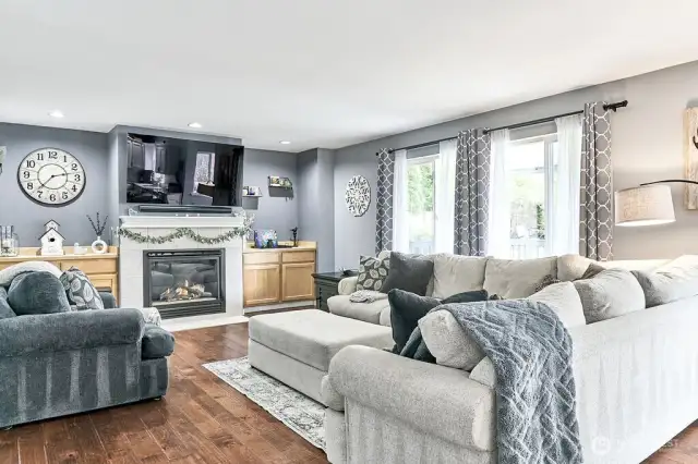 Large windows overlooking patio and back yard