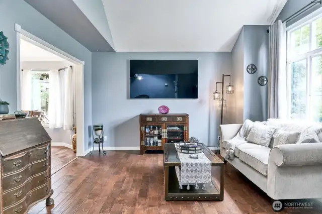 Formal living room with light bright front window