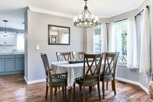 Formal dining room with bright bay window