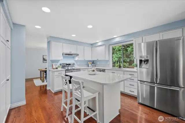 Stainless Steel appliances and refreshed kitchen with updated cabinets and quartz counters.