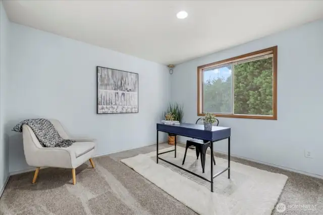 Extra flex space/office overlooks to below into the living room.
