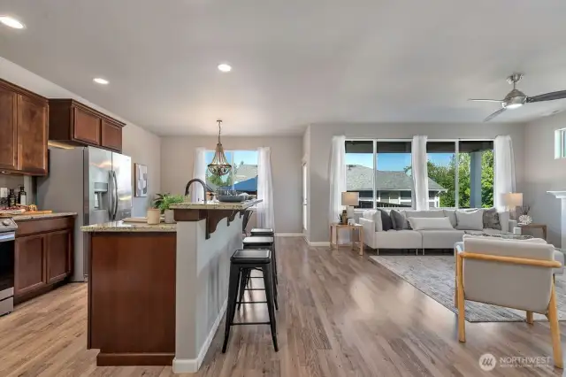 View of breakfast bar seating and open layout perfect for entertaining or gatherings.