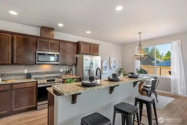 Modern Kitchen – Upgraded appliances, sleek glass touch controls, and a large prep island make cooking effortless.