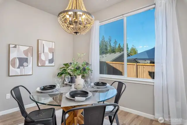 Bright dining space with smart lighting overlooking the backyard.