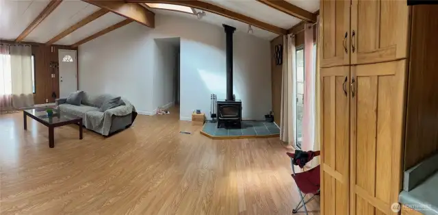 Spacious, Open Living Room With Vaulted Ceiling, Fireplace & Lots Of Natural Light Flowing In