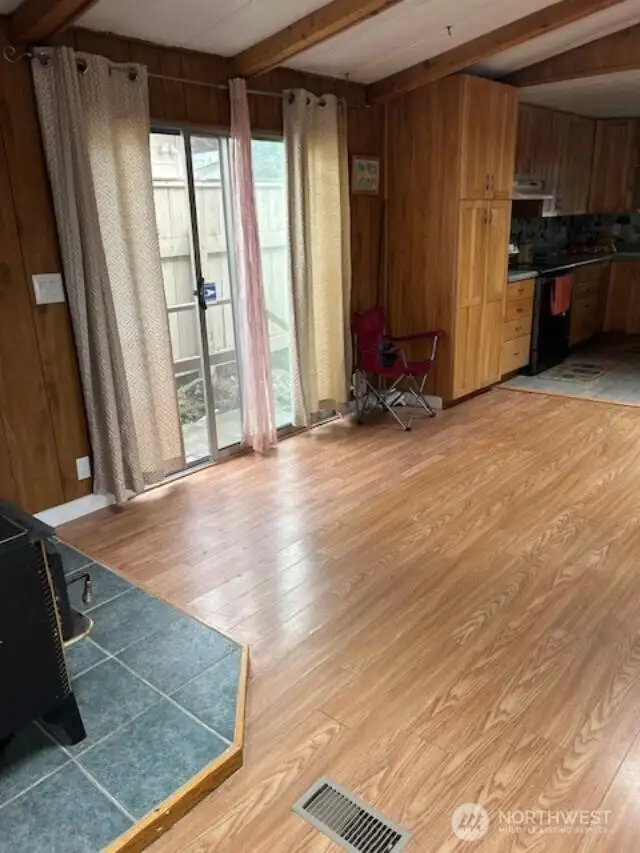 Living Room With Slider That Goes Out To Back Of Home.
