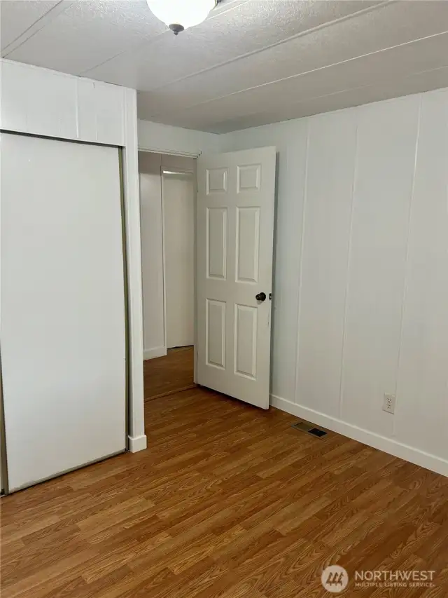 3rd bedroom with new flooring and moulding