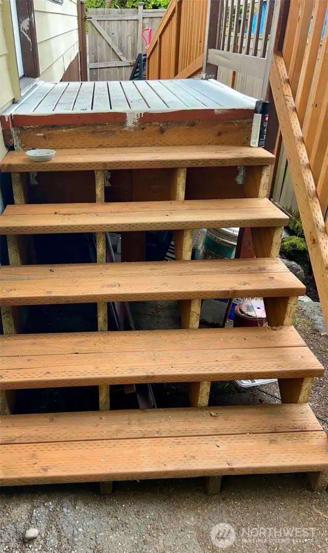 Brand new stairs leading to the front door.
