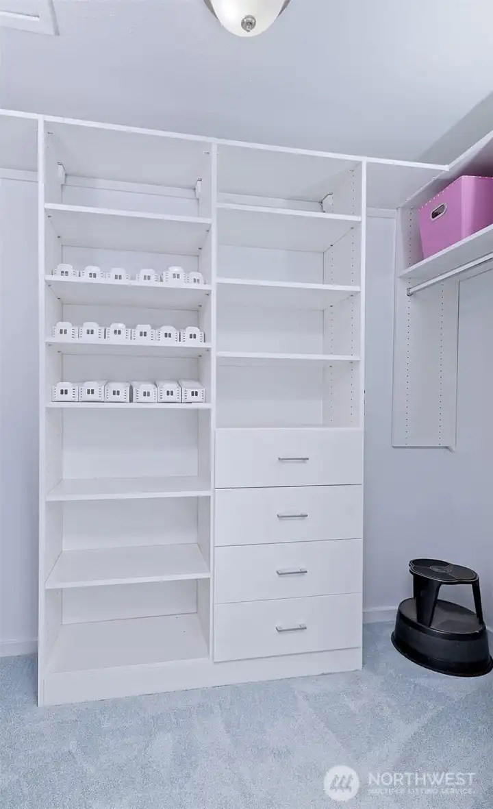 Primary bedroom closet organizer.