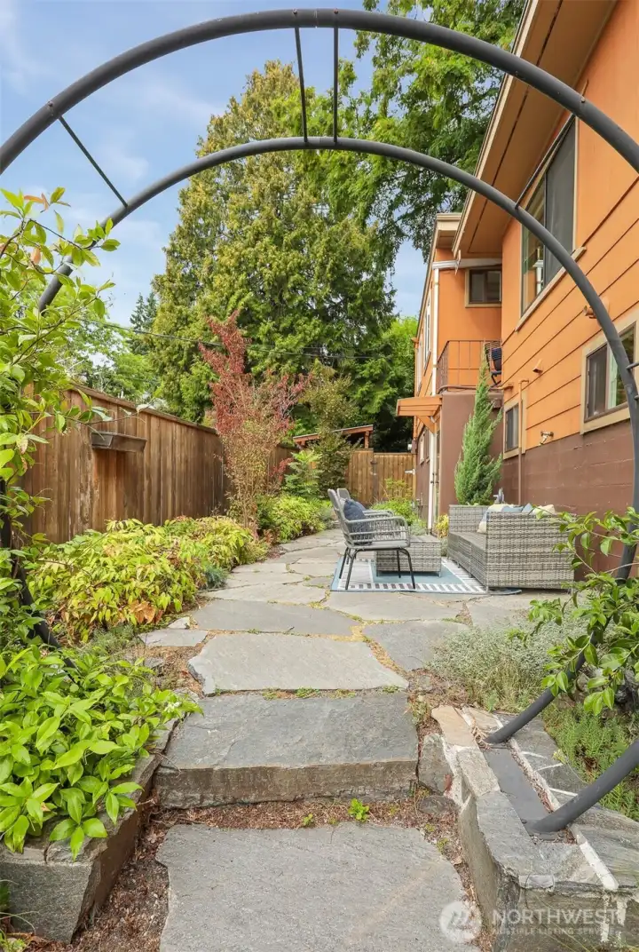 Professionally architect designed ($50,000 project)  fenced courtyard with access to the Main south home lower level and custom built cedar shed.