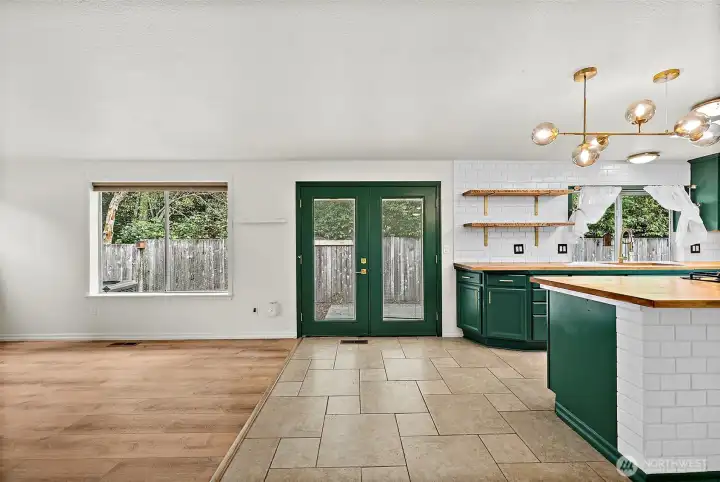 The kitchen has French doors that lead to the back patio.