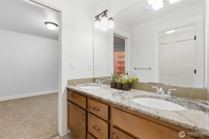 Upstairs, Jack and Jill bathroom between Bedroom #2 & 3. Featuring two sinks, full bath, granite counter tops and soft close drawers.