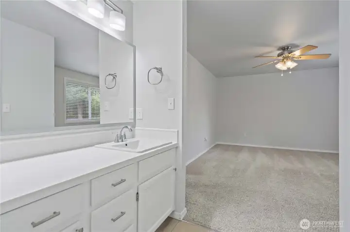 A look to the primary bedroom from the bath
