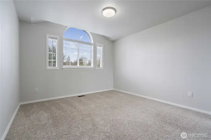 Bedroom 2 features an architectural window...another good sized room