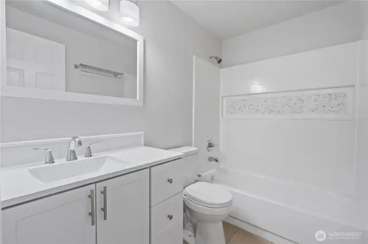 Hall bath is fresh and neutral!