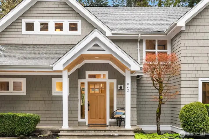 The covered front door entry is gracious and welcoming.