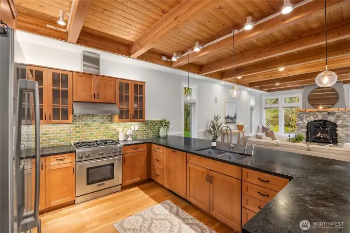 Bosch fridge, Thermador range with propane cooktop and Miele dishwasher.