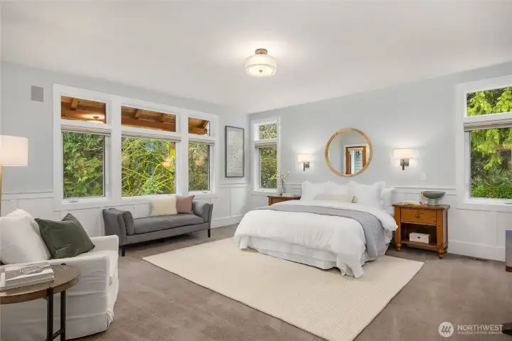 The primary suite has beautiful southerly light and opens to the upper patio.