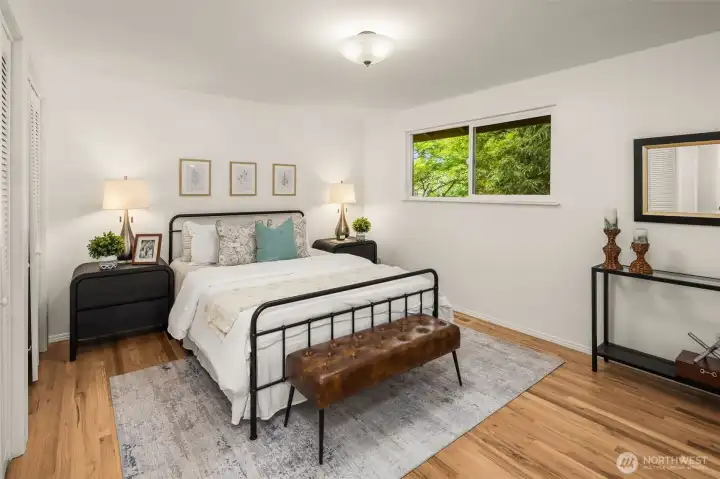 Primary suite w/dual closets and adjacent bathroom