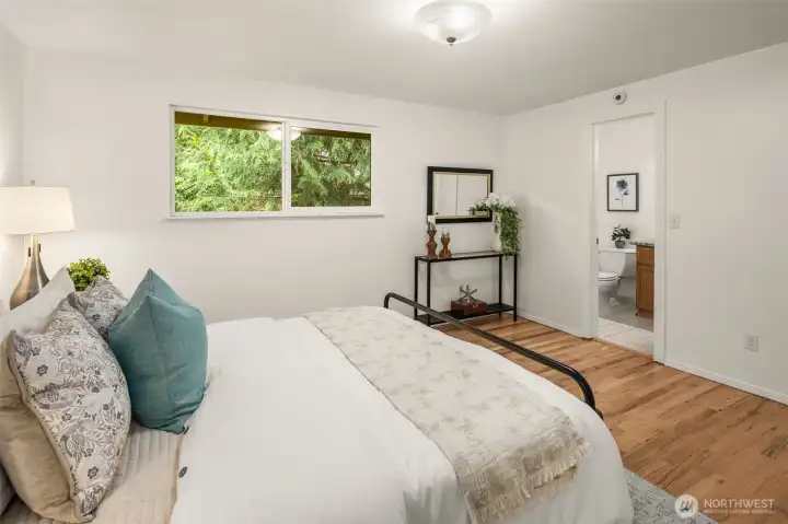 Primary suite w/dual closets and adjacent bathroom
