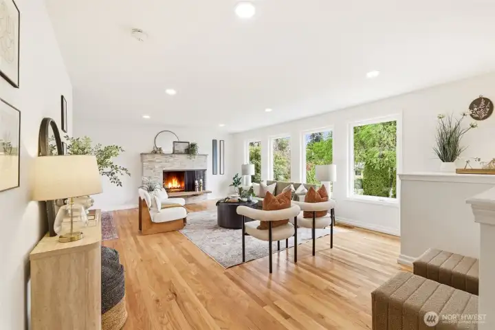 Open living area with abundant natural light and hardwood floors