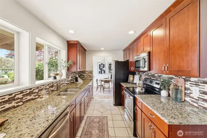 Galley kitchen with generous counter space and extensive storage
