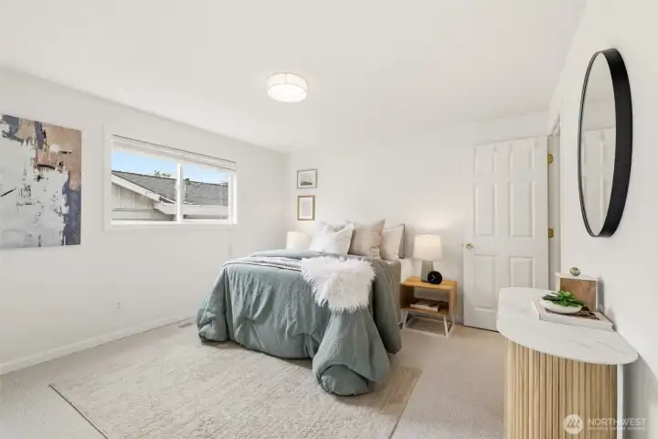 Main floor primary bedroom with generous space and natural light