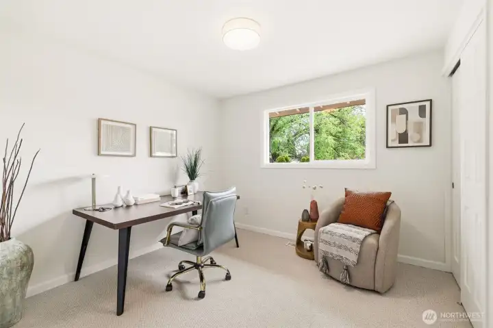 Main floor bedroom 2, ideal for guests, office, or flex space