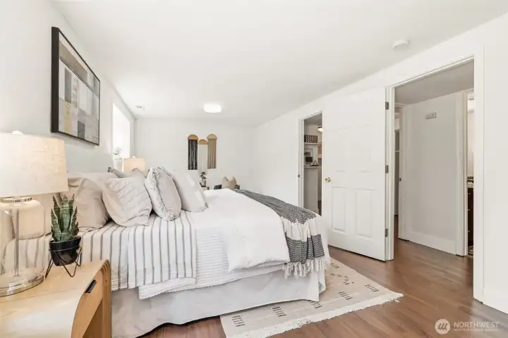 Generous lower level bedroom with en suite access and flexible use